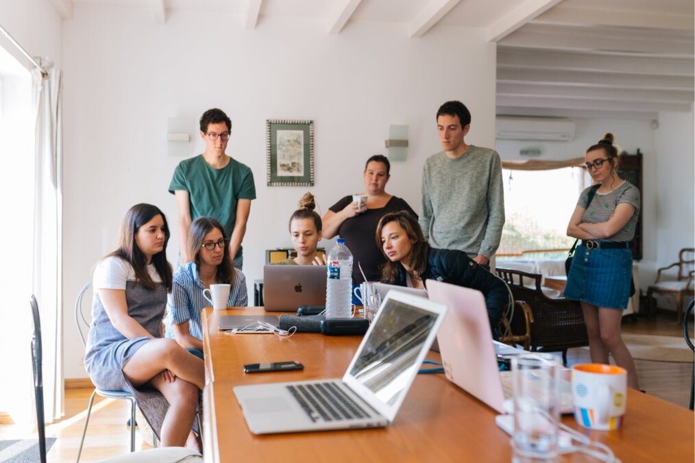 Interns in the office A group of interns working in the office